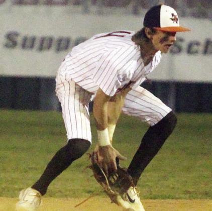 Shortstop Conner Lichnovsky secures a grounder before getting a force out at second base against Giddings. Sticker Photo By Darrell Vyvjala