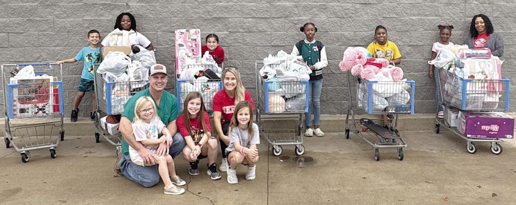Kainers provide Christmas shopping trip for six Boys &amp; Girls Club members