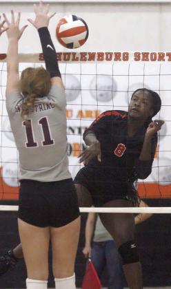 Jessalyn Gipson gets a kill off an Industrial block in the first set last Thursday. Sticker Photo By Darrell Vyvjala