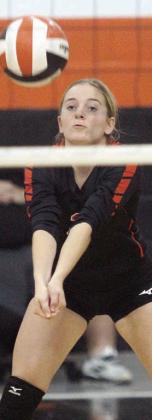 Madison Kunschick sends a pass on its way against Industrial. Sticker Photo By Darrell Vyvjala