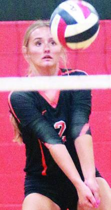 Miranda Bonner passes from the back row in a match on Thursday. Sticker Photo By Darrell Vyvjala