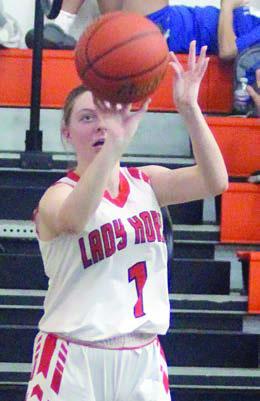 Kaylee Beyer puts up a shot in the first quarter Thursday morning. Sticker Photo By Darrell Vyvjala