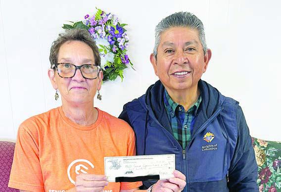 Donation – Joe Jimenez (right) dropped by the Senior Connections Weimar location with a donation from the Knights of Columbus Fourth Degree. Accepting the check was Stephanie Shroyer (left), program director. Senior Connections is so grateful to him and the organization for the support.