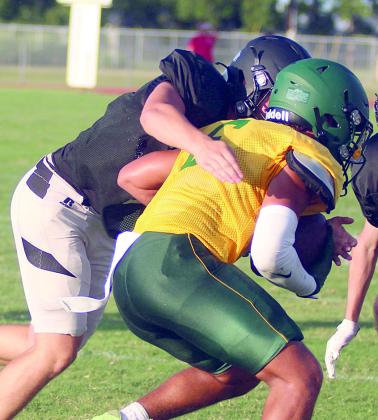 Owen Brenek runs down an Eagle after a short gain last week. Sticker Photo By Darrell Vyvjala