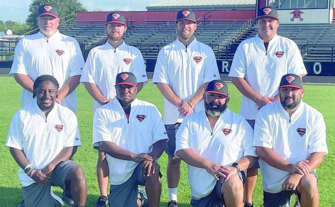 SHORTHORN COACHING STAFF Kneeling, from left: Jaylen Samuels, Brandon Williams, Isaiah Barrera, and Cameron Besetzny. Standing, from left: Brad Oden, Jordan Hafley, head coach Luke Hobbs, and Marty Bigham. Sticker Photo By Darrell Vyvjala