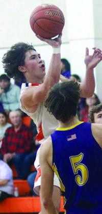 Jayse Janda scores on a third-quarter drive for two of his 15 points against Weimar. Sticker Photo By Darrell Vyvjala