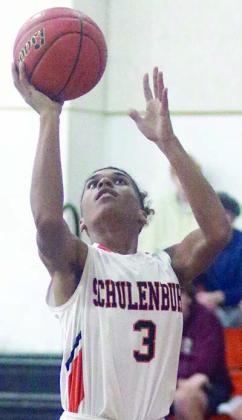 Byron Johnson goes up for a layup in the second half of last Friday morning’s tournament game. Sticker Photo By Darrell Vyvjala
