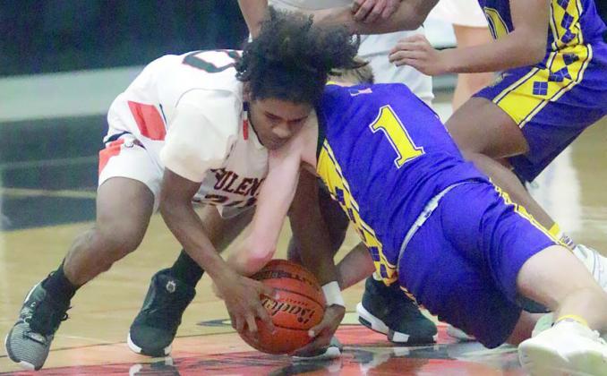 Aiden Medrano forces a Wildcat turnover in the second half on Dec. 20. Sticker Photo By Darrell Vyvjala