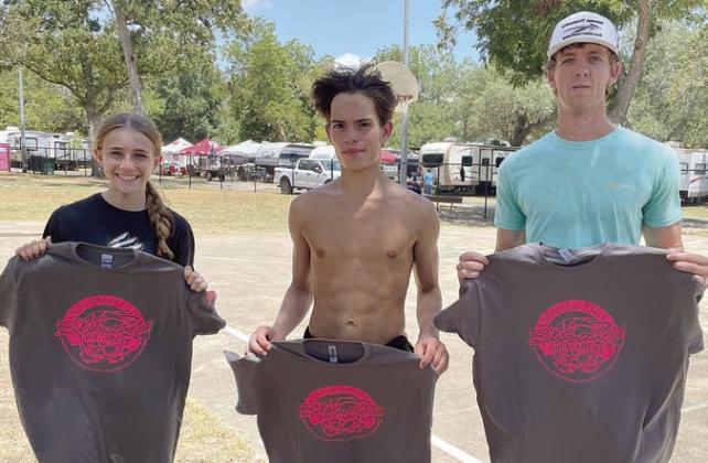Three-point contest winners – (from left) Jenna Guentert, youth female division; Gavin Almaguer, youth male division; and Jack Seyl, adult division. Sticker Photo By Darrell Vyvjala