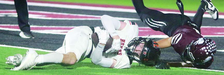 Nick Goode keeps control of the ball as he hits the ground after making a leaping catch for 31 yards in the fourth quarter.