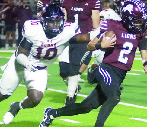 Tavondrick Ellison chases Jericho Jackson from the pocket in the third quarter.