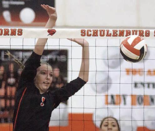 Brooke Redding taps down a Lady Hornet over-pass in the first set on Sept. 26. Sticker Photo By Darrell Vyvjala