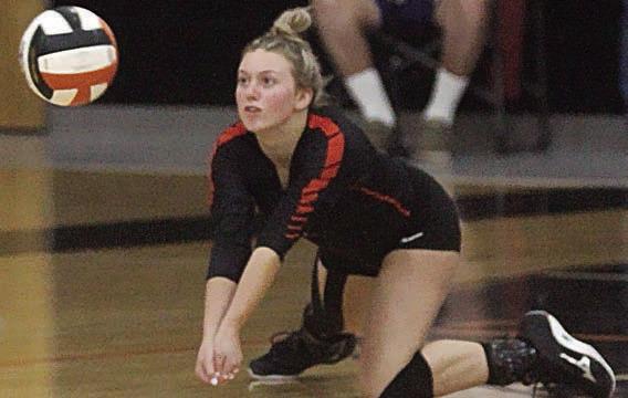 Avery Helms goes down to dig a Lady Hornet attack in the second set last Tuesday. Sticker Photo By Darrell Vyvjala