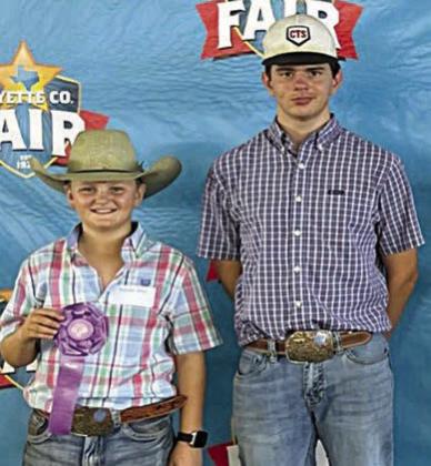 Kooper Kirts, grand  champion, and Kandon Kaspar, reserve champion; Pen of 1 Heifer