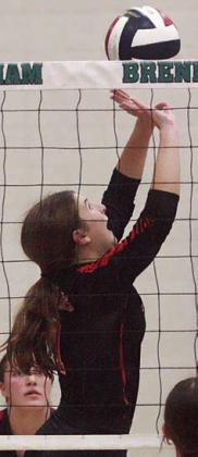 Collaborating for match point of the regional championship, Landry Zapalac sends the set and Meredith Magliolo swings for the kill. Sticker Photos By Darrell Vyvjala