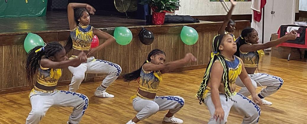 Members of the Lady Pythons dance at Saturday’s event. Sticker Photo By Darrell Vyvjala