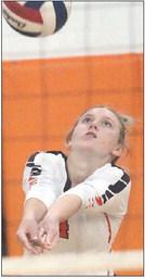 Avery Helms passes the ball in the third game against Poth. Sticker Photo By Darrell Vyvjala