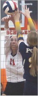Meredith Magliolo battles for a ball at the net with a Pirette in game three. Sticker Photo By Darrell Vyvjala