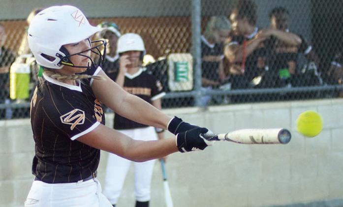 Aubryn Janda sends a double to left field against Louise to plate two runs in the bottom of the first inning. Sticker Photo By Darrell Vyvjala