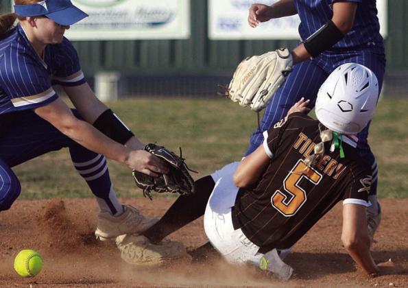 Kinley Tillery slides in safely with a theft of second base last Tuesday. Sticker Photo By Darrell Vyvjala