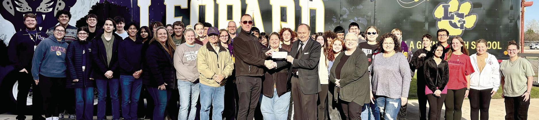 KVLG KBUK donates toward La Grange ISD band trip to New York City