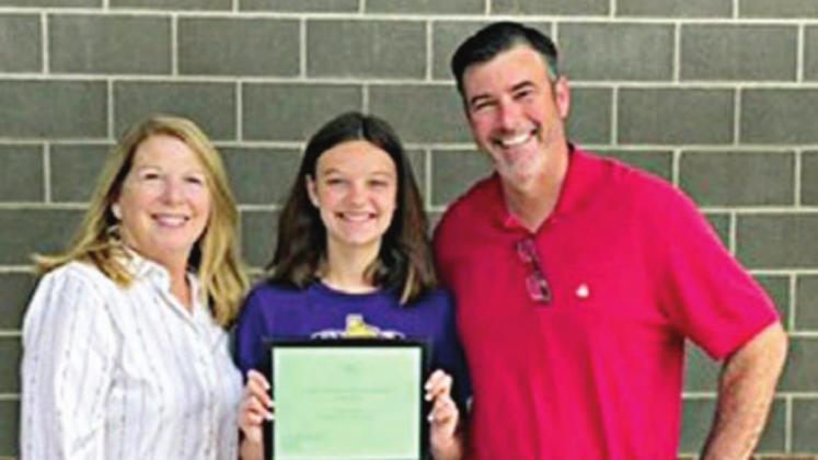 7TH GRADE • 1ST PLACE WINNER – Evelyn Johnson (center) of Shiner ISD with her father, Wade Johnson (right), and NVCW “Beef for Father’s Day” chair Suzette Surman (left).