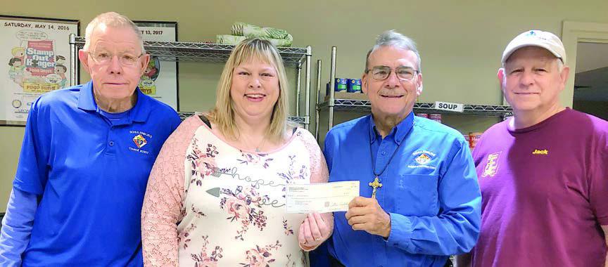 Schulenburg Knights of Columbus Council 2902, represented by Ken Berger (left) and Ed Kusy (third from left) donated $500 to the Schulenburg Area Food Pantry. Accepting the donation are Food Pantry secretary Sheila Brossmann (second from left) and Food Pantry vice president Jack Niesner (right).