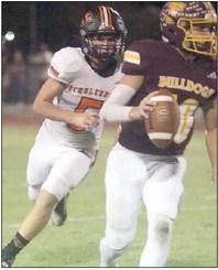 Brycen Schramek chases the Thorndale quarterback to the sideline to help force an interception in the first quarter. Sticker Photo By Darrell Vyvjala