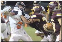 John Davis tries to cut off a Bulldog runner in the fourth quarter despite being held up. Sticker Photo By Darrell Vyvjala