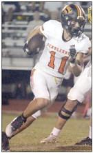 Jayse Janda gets around the end on a shovel pass in the second quarter to convert on third and 5. Sticker Photo By Darrell Vyvjala