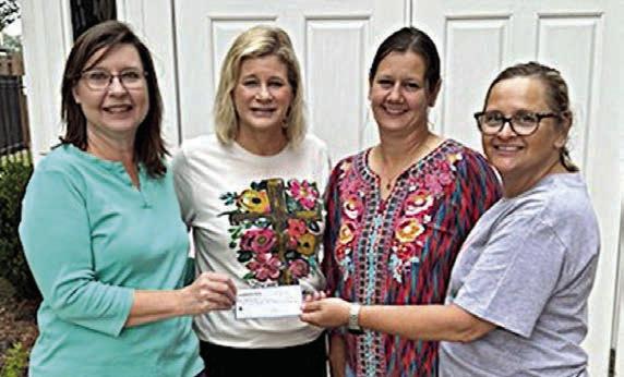 St. Anne’s Society presents donations