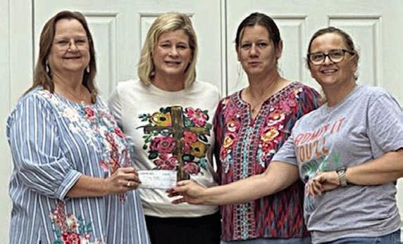 St. Anne’s Society presents donations
