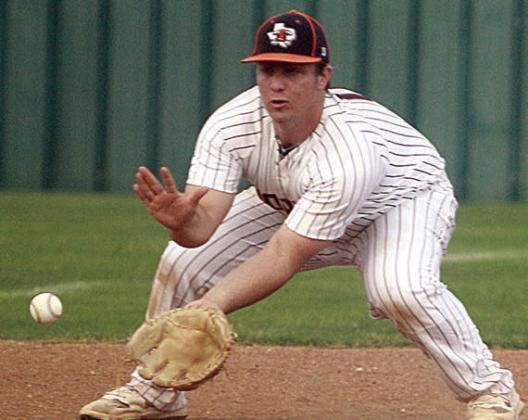 Third baseman Tyson Wagner looks a grounder into his glove for an out against Ganado. Sticker Photo By Darrell Vyvjala