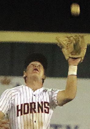 Shortstop Reid Janda gets under a popup in shallow centerfield on Friday. Sticker Photo By Darrell Vyvjala