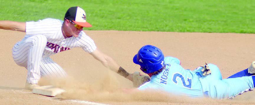 Third baseman Reid Janda tags an Indian for an out in the Horns’ 3-2 win. Sticker Photo By Darrell Vyvjala