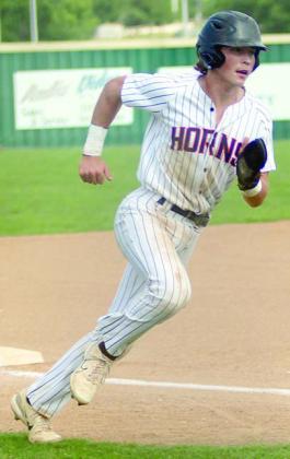 Jayse Janda heads home with the Horns’ first run on Friday. Sticker Photo By Darrell Vyvjala