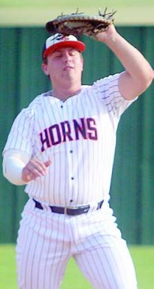 First baseman Tyson Wagner squeezes an Indian popup. Sticker Photo By Darrell Vyvjala