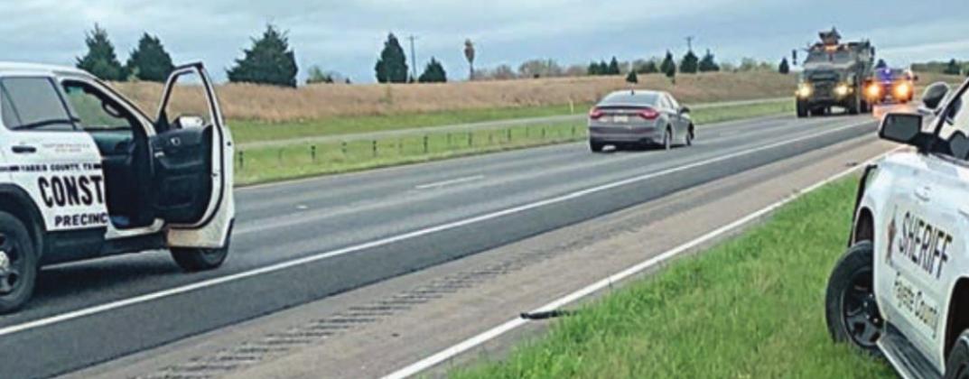 Authorities surround the suspect’s vehicle. Photo Courtesy of Fayette County Sheriff’s Department