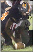 Aidan Mendez gets a fumble recovery in the third quarter. Sticker Photo By Layne Vyvjala