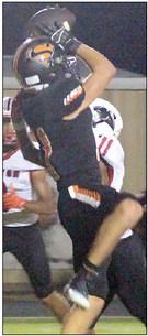Jayse Janda makes a fourth-down catch in the fourth quarter. Sticker Photo By Layne Vyvjala