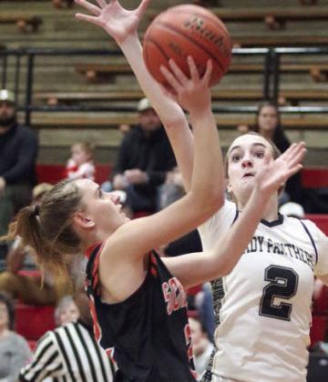 Miranda Bonner goes to the basket for a first-quarter score. Sticker Photo By Darrell Vyvjala