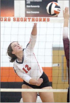 Grace Schramek sends a kill over the net in game one against Flatonia. Sticker Photo By Darrell Vyvjala