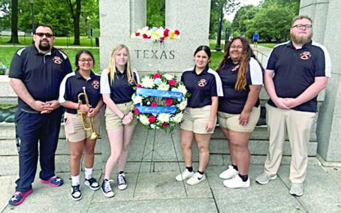 SISD Director of Bands Justin Bartlett; Yahaira Guerrero, junior, who played TAPS on trumpet to conclude the ceremony; Teagan Faith, Priscila Lara and Elvia Lara, senior band members who placed the wreath; and Assistant Band Director Fabian Weirich.
