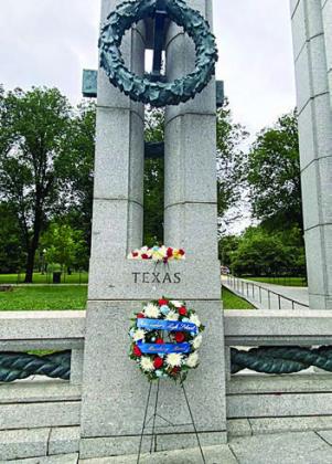 The wreath in front of the Texas Column.