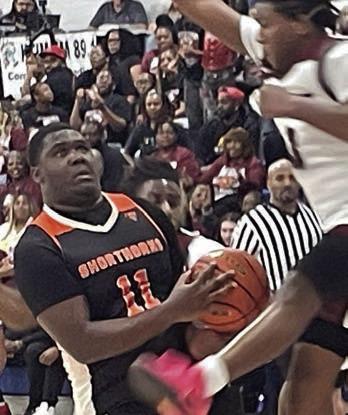 Tavondrick Ellison gets an Eagle in the air to draw a foul in the third quarter. Sticker Photo By Darrell Vyvjala