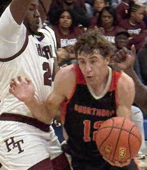 Van Prihoda slips by an Eagle on a second-quarter drive. Sticker Photo By Darrell Vyvjala
