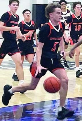 Jamison Bennett heads to the hoop on his way to drawing a foul in the fourth quarter. Sticker Photo By Darrell Vyvjala