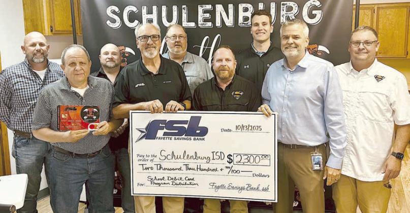 As Fayette Savings Bank presented a check to Schulenburg ISD through its School Spirit Debit Card Program, on hand were (from left) Brad Tumis and Rodney Kalich, FSB; Jarrod Schramek, SISD board; Mike Olle, FSB; Michael Zweschper, Michael Demel and Hale Hentges, SISD board; SISD Supt. Lee Hafley; and Troy Brenek, SISD board.