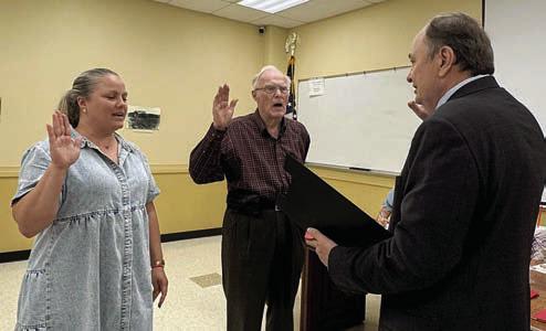 NEW Executive COMMITTEE MEMBERS SWORN IN – Christyna Fitzpatrick (left) and Arnold Romberg (center) were sworn in as newly elected executive committee members by Dan Mueller (right).