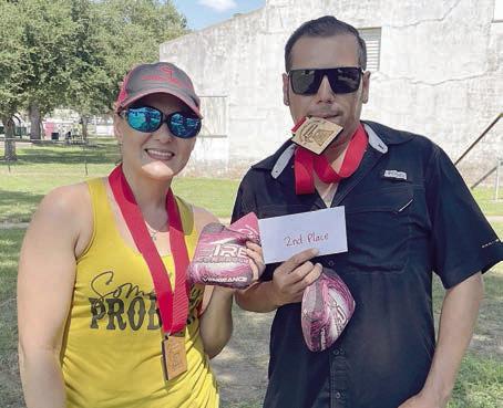 Second Place – “Hole Patrol” - (from left) Steffani King and Rudy Perez III. Sticker Photo By Darrell Vyvjala